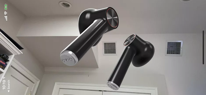 Les OnePlus Buds, flottant dans l'air au-dessus de mon bureau alors que j'essayais de prendre des photos virtuelles du produit à la volée. Scott Stein/CNET